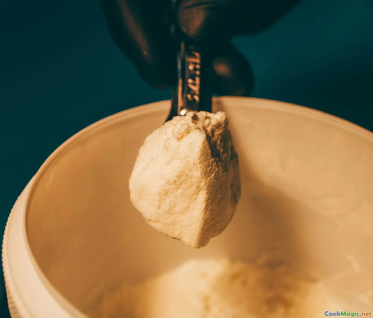 baking ingredients, measuring spoons, mixing batter, vanilla bean