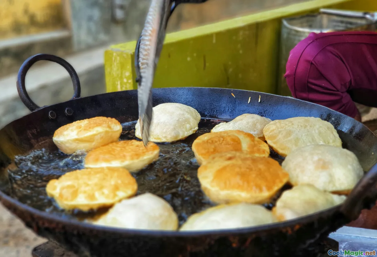 Belarusian blini cooking, flipping pancakes, golden blini