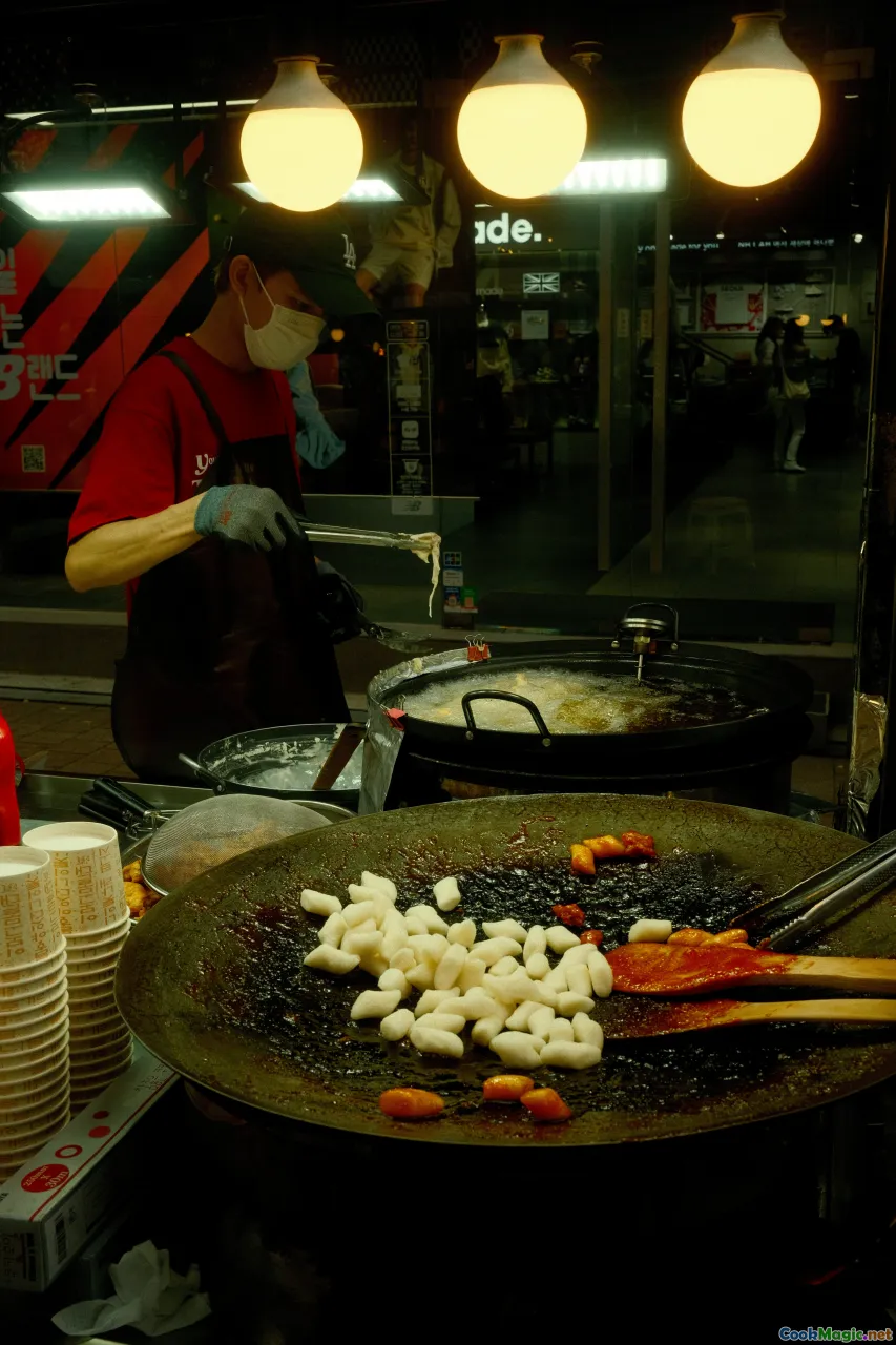 bustling korean restaurant, family dinner, chef plating banchan