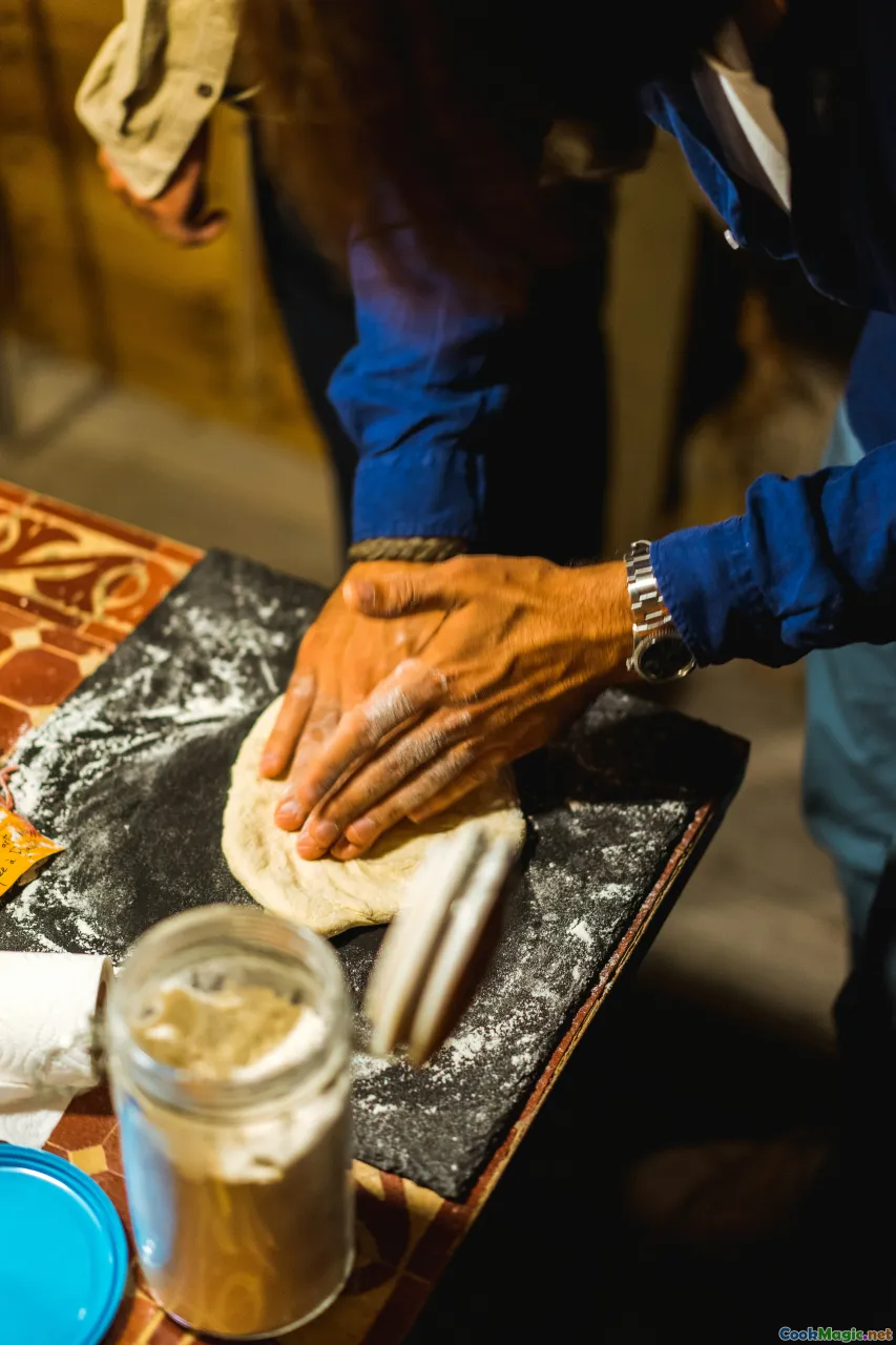 chef plating cheese, traditional Maltese table