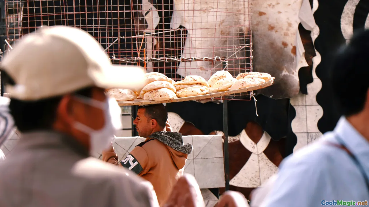 community baking, village festival, bread being shared, traditional gathering