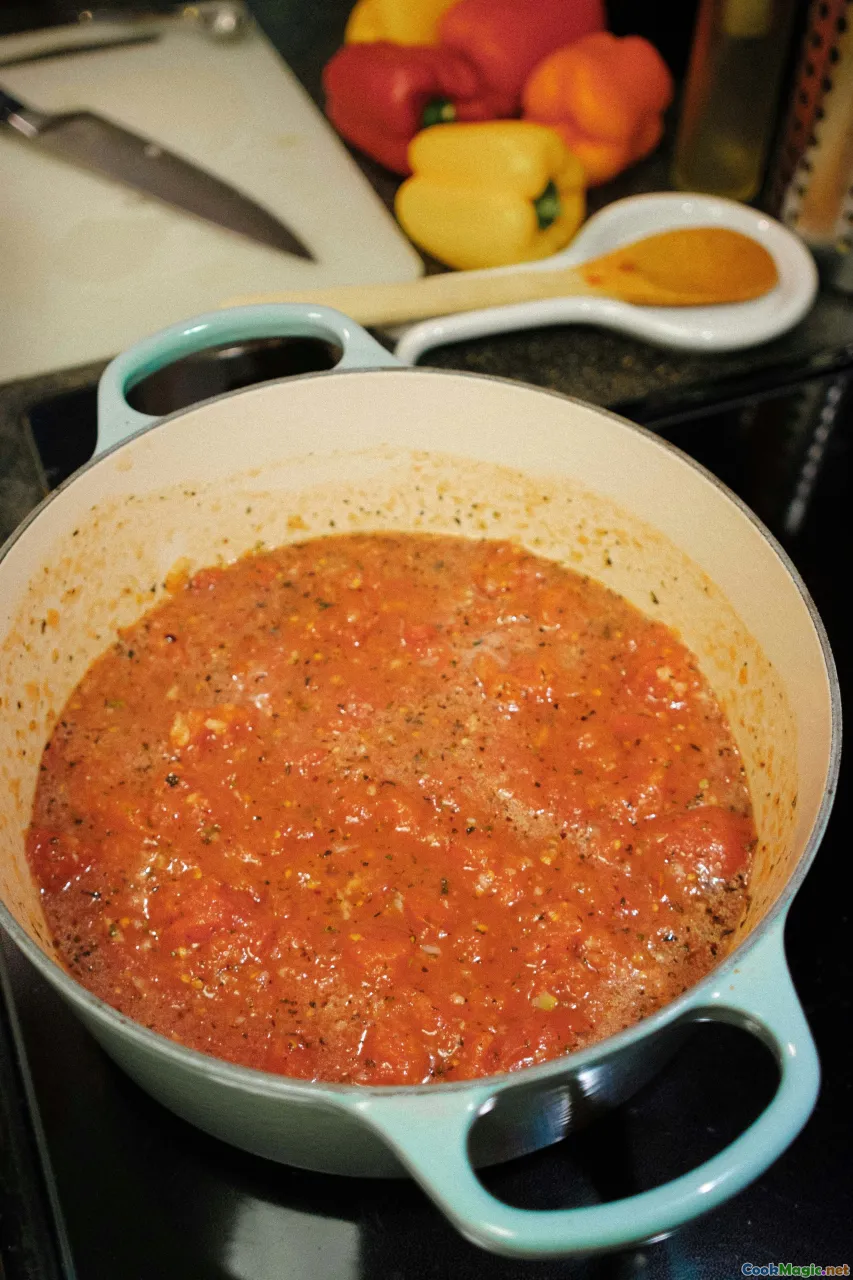 cooking process, sauce pouring, tomato mashing, variety of ingredients