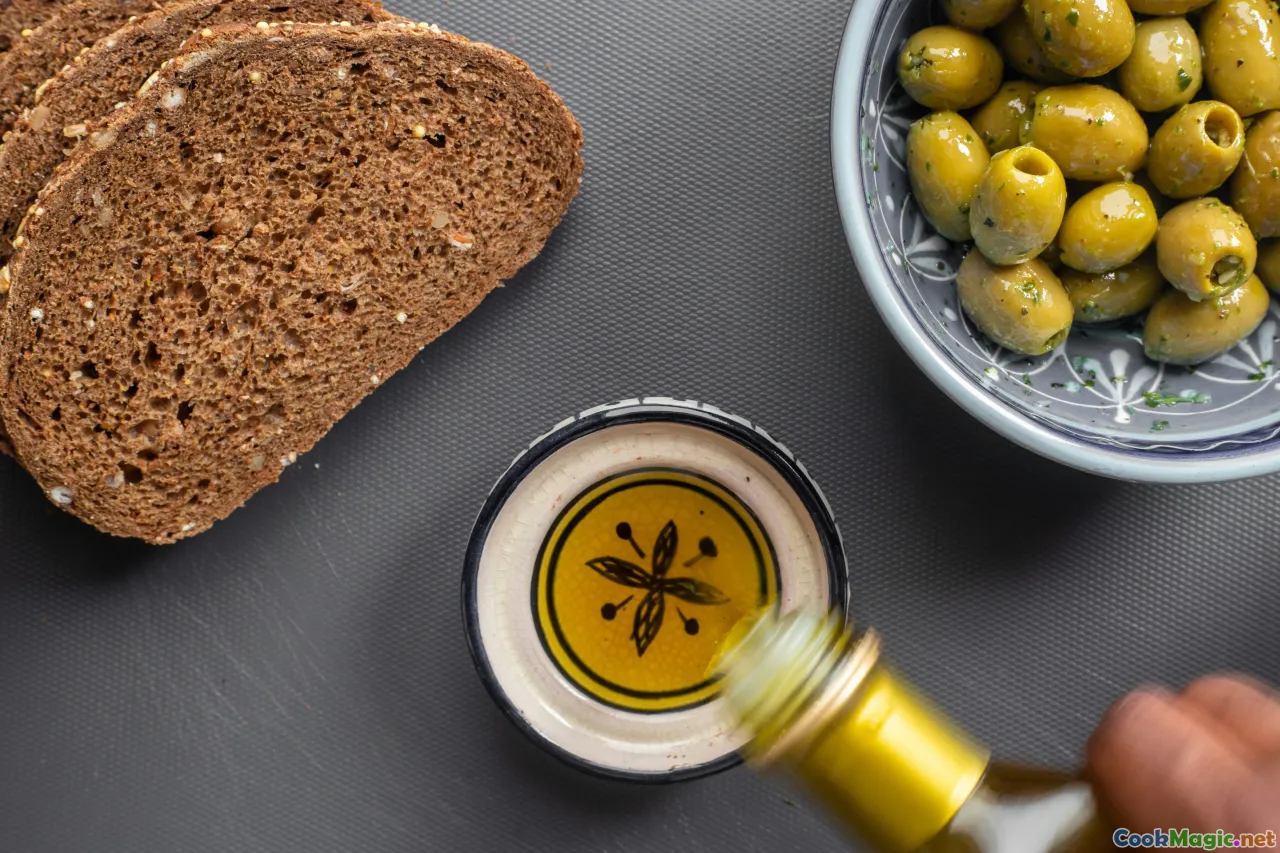 sea table, olive oil pour, rustic bread, sunset