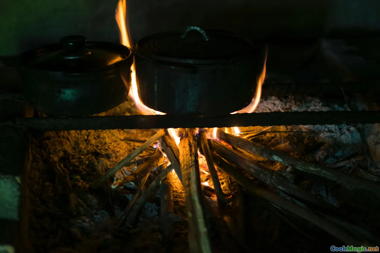 seasoning spices, open flame cooking, traditional pots