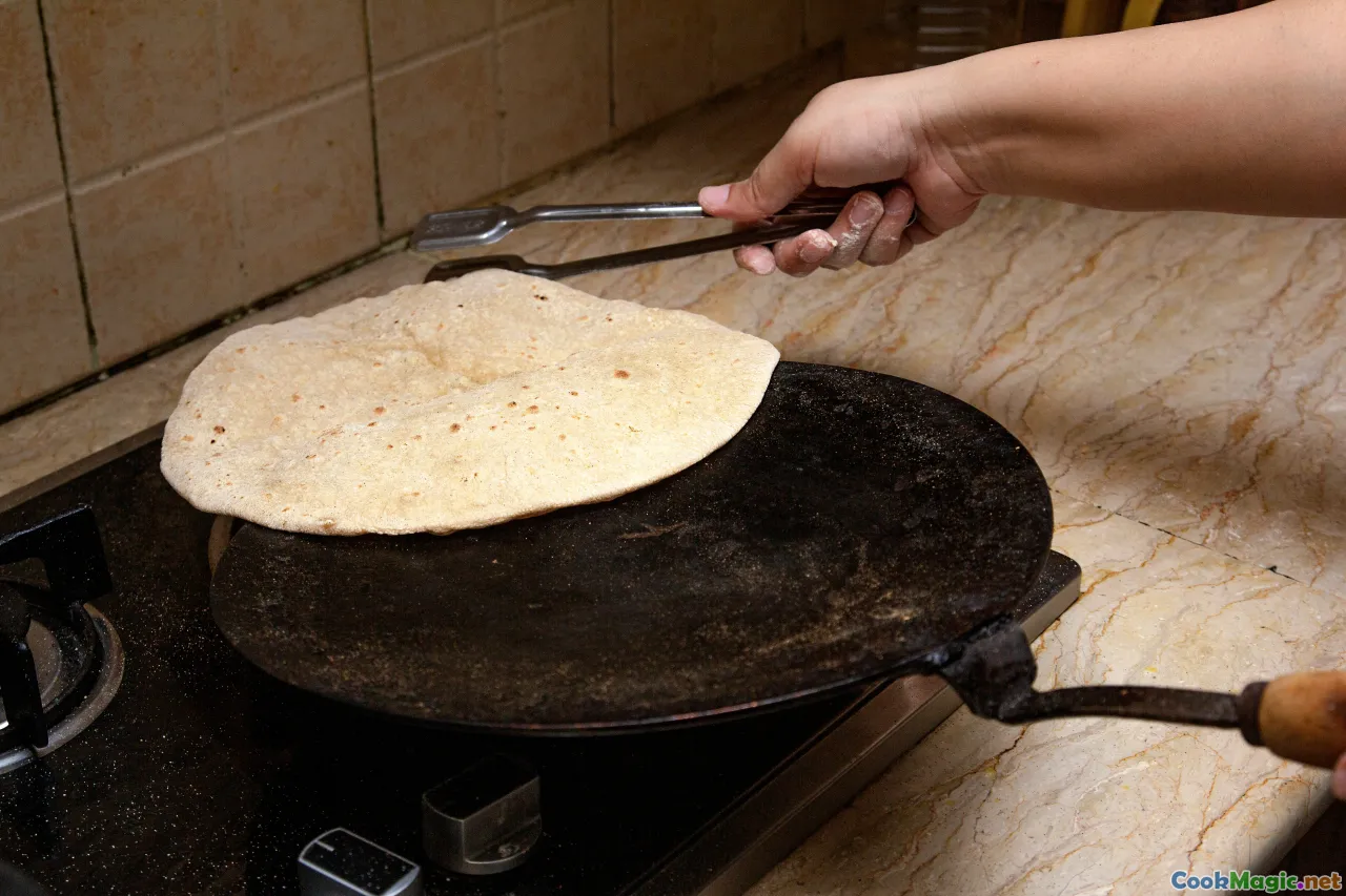traditional Pakistani kitchen, rolling pin, flour, dough, rustic bread