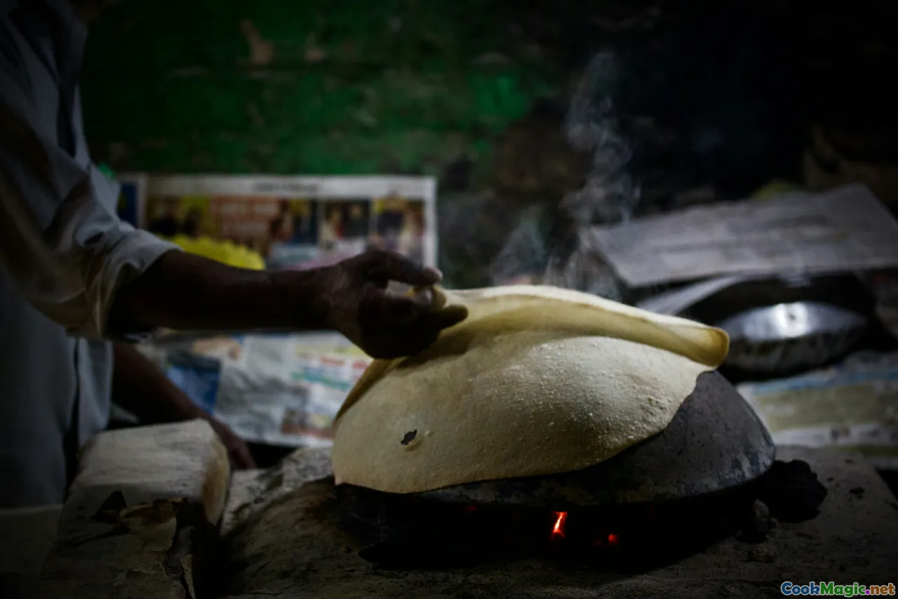 urban kitchen, steaming pot, banana leaves, home cooking