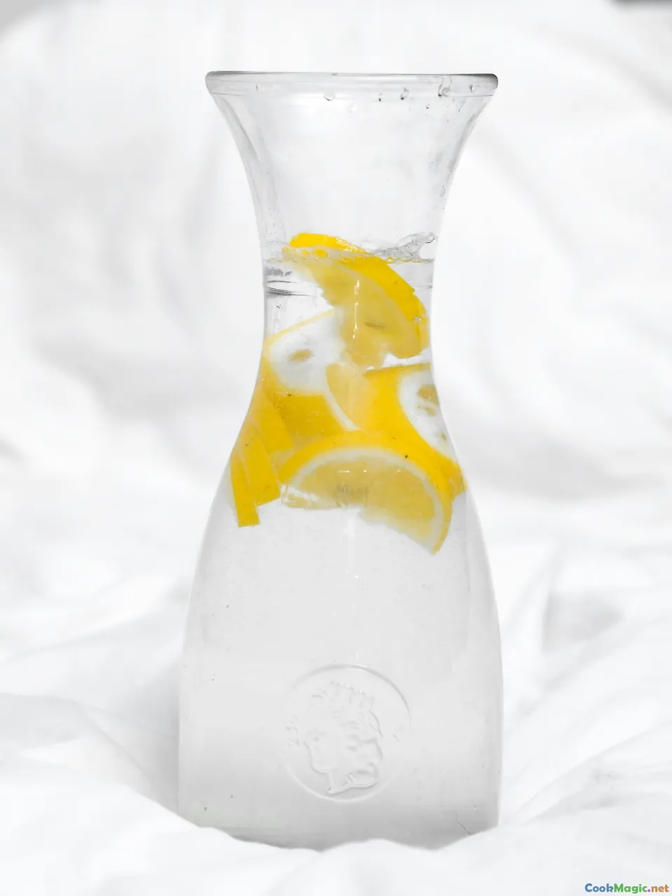 vodka frosted bottle, shot glasses, lemon peel, kvass