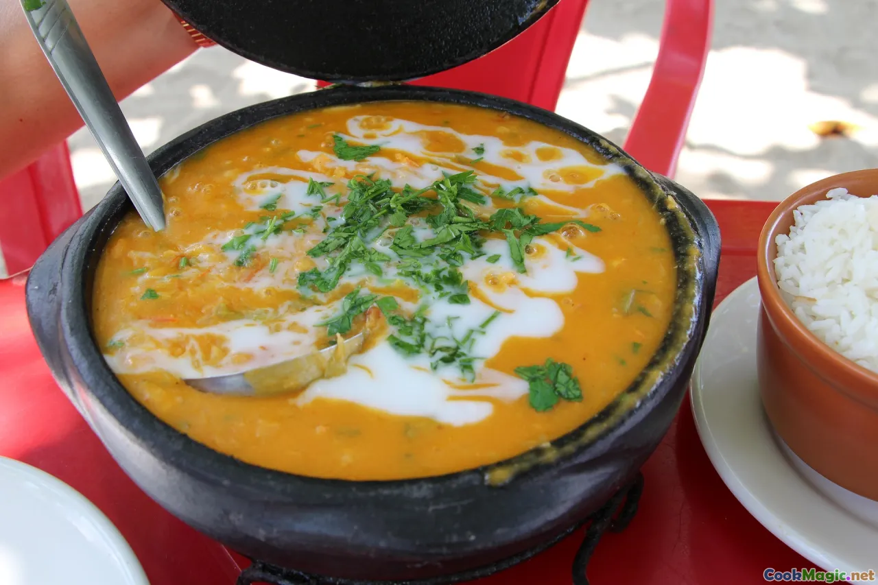Moambé dish, palm wine, fish stew