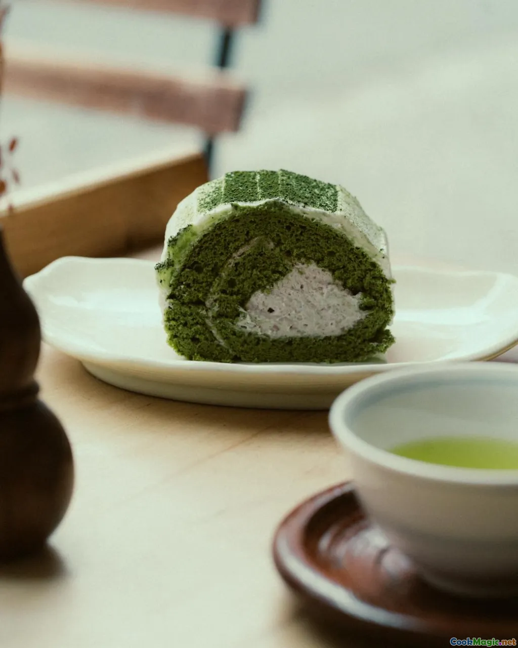 aromatic tea leaves, ornate tea cup, soft pastries, textured cake layers