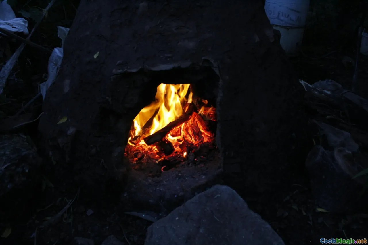 earth oven, hot stones, firewood, pit