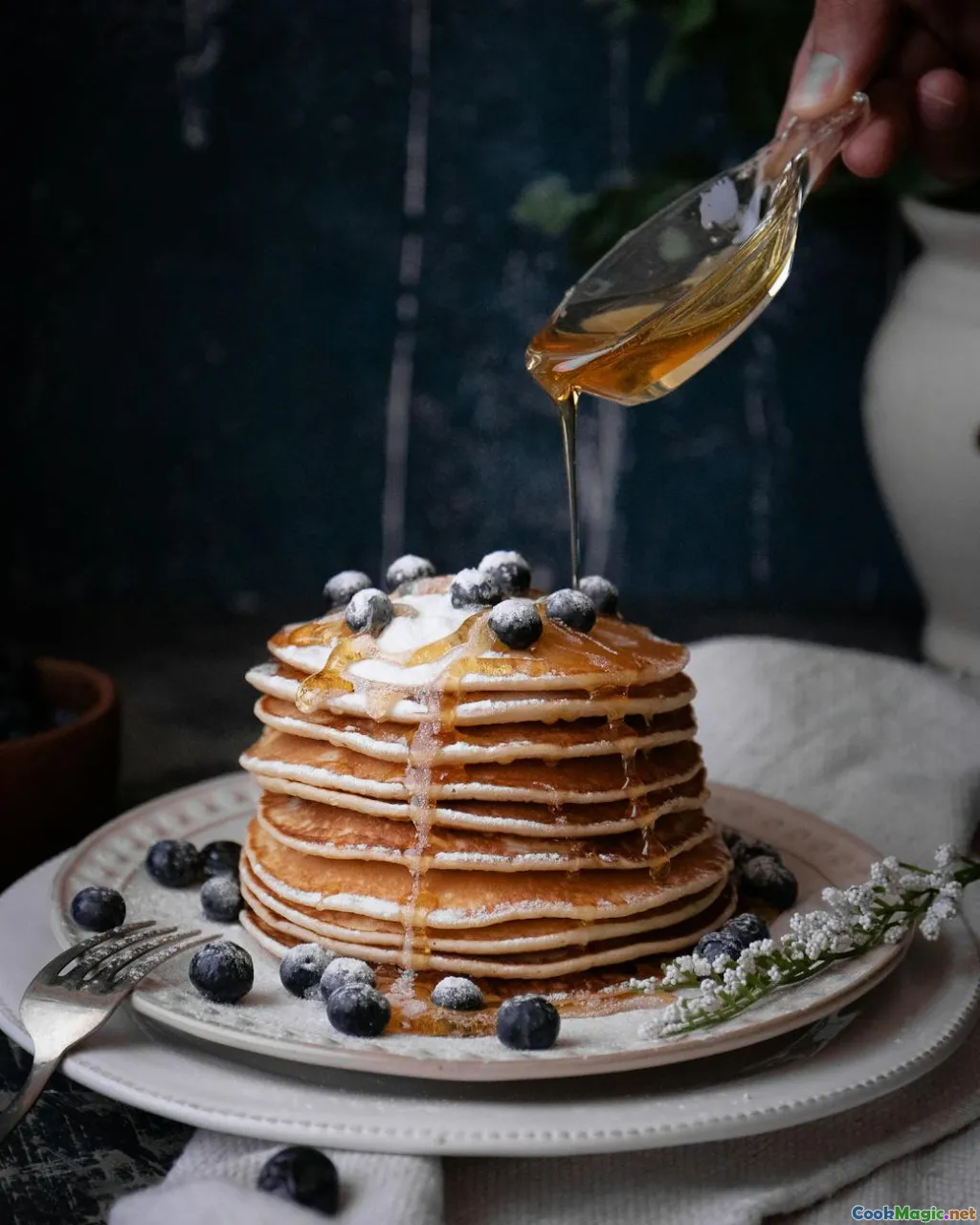 honey drizzled on buckwheat pancakes, Baltic kitchen table
