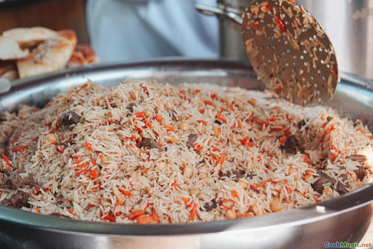 plov, rice, carrots, meat, cooking pot
