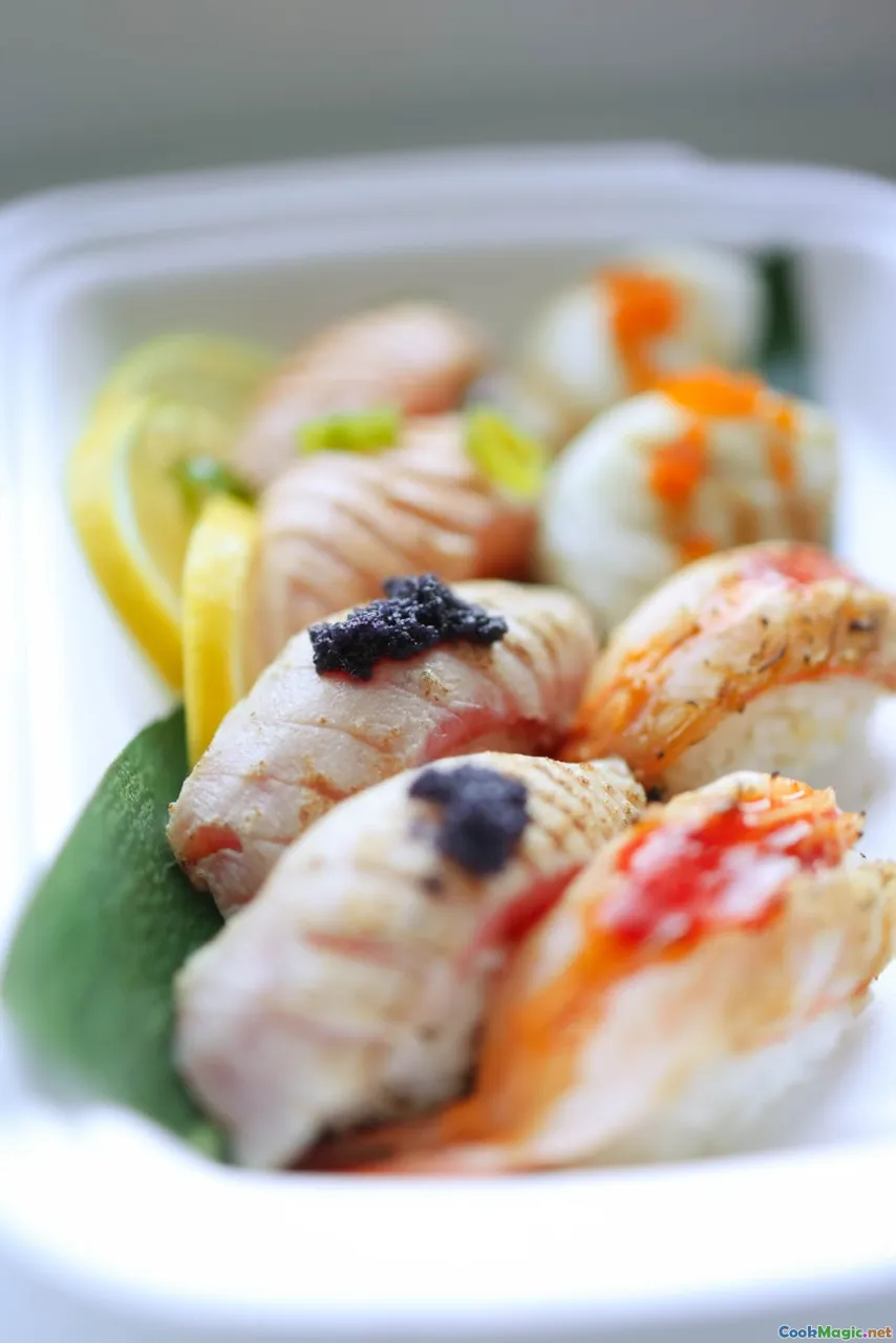 smoked salmon, herring under fur coat, caviar, lemon wedges