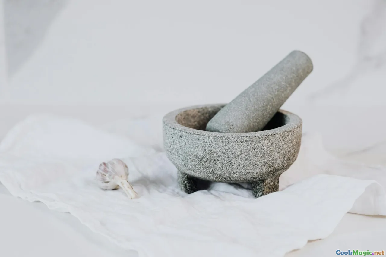 spice jar, grinder, mortar and pestle