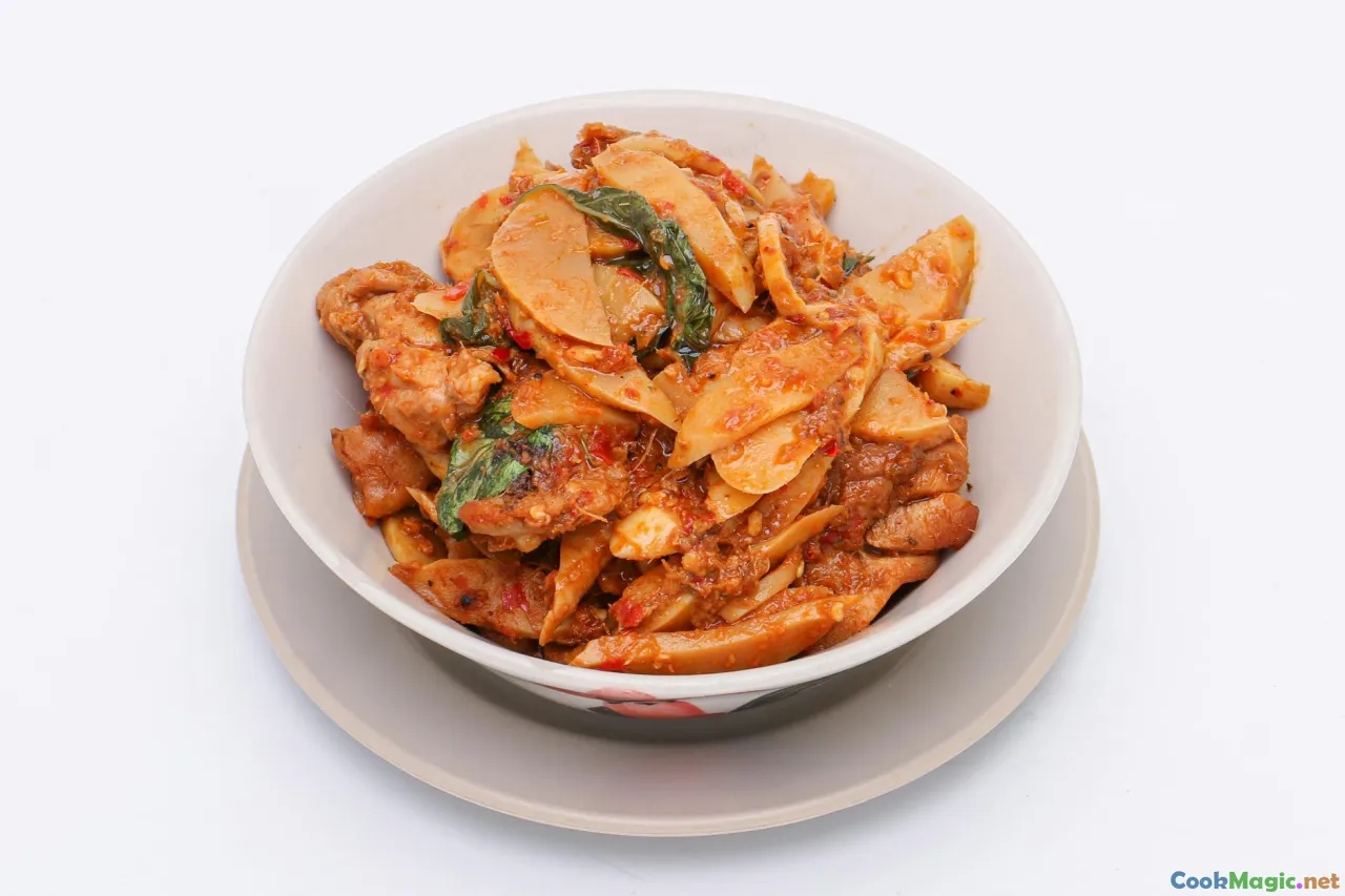 Thai basil, simmering curry, eggplants, ladle